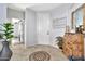 Well-lit entryway with wood flooring, gray paint, wood accent decor, and a view into other rooms at 5110 S Sandstone St, Gilbert, AZ 85298