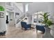 Inviting foyer with high ceilings, lots of natural light, an open staircase with iron railings, and tile flooring at 5110 S Sandstone St, Gilbert, AZ 85298