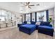 Bright living room with plenty of natural light, wood floors, and cozy seating, perfect for entertaining at 5110 S Sandstone St, Gilbert, AZ 85298