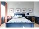 Charming bedroom with a blue-themed palette, playful artwork, and stylish decor accents at 5144 E Calle Del Medio --, Phoenix, AZ 85018