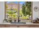 Kitchen sink with a view of the mountain and backyard at 5144 E Calle Del Medio --, Phoenix, AZ 85018