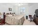 Bedroom featuring a shuttered window, ceiling fan, and traditional furnishings at 5545 E Helena Dr, Scottsdale, AZ 85254