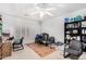 Bedroom with a ceiling fan, window, and desk at 5545 E Helena Dr, Scottsdale, AZ 85254