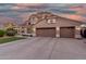 Charming two-story home featuring a tile roof, stucco exterior, well-manicured lawn, and a two-car garage at 5545 E Helena Dr, Scottsdale, AZ 85254