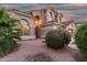 Charming two-story home featuring a tile roof and stucco exterior with desert landscaping and mature shrubbery at 5545 E Helena Dr, Scottsdale, AZ 85254