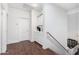 Bright hallway features wood floors, white walls, and a built-in cabinet for added storage and decor at 5545 E Helena Dr, Scottsdale, AZ 85254