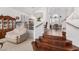 Elegant living area with staircase, hardwood floors, and bright white walls at 5545 E Helena Dr, Scottsdale, AZ 85254