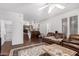 Cozy living space with dark wood floors and staircase leading up to the kitchen at 5545 E Helena Dr, Scottsdale, AZ 85254