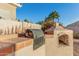 Outdoor kitchen complete with a built-in barbecue grill and brick pizza oven perfect for entertaining at 5545 E Helena Dr, Scottsdale, AZ 85254