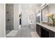 Bright bathroom featuring a freestanding tub, glass enclosed shower, marble floors, and decorative chandelier at 5904 E Calle De Las Estrellas Rd, Cave Creek, AZ 85331