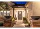 Close-up of the front door with decorative wreath and sidelight windows at 5904 E Calle De Las Estrellas Rd, Cave Creek, AZ 85331