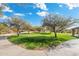 Lush green space featuring a walkway and mature trees providing shade, surrounded by a well-maintained lawn at 5904 E Calle De Las Estrellas Rd, Cave Creek, AZ 85331