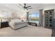 Bright main bedroom with neutral tones, ceiling fan and bench at 5904 E Calle De Las Estrellas Rd, Cave Creek, AZ 85331