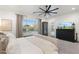 Bright main bedroom featuring neutral tones, ceiling fan and backyard view at 5904 E Calle De Las Estrellas Rd, Cave Creek, AZ 85331