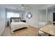 Comfortable bedroom featuring neutral decor, a fan, a closet and access to a workspace at 6325 N 83Rd Pl, Scottsdale, AZ 85250