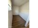 Small, empty closet features light walls and wood-look tile flooring at 6325 N 83Rd Pl, Scottsdale, AZ 85250