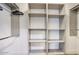 Modern closet with adjustable shelving and chrome hanging rods for optimal organization at 6325 N 83Rd Pl, Scottsdale, AZ 85250