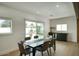 Bright dining room featuring sliding glass doors to the pool and a built in bar for entertaining at 6325 N 83Rd Pl, Scottsdale, AZ 85250