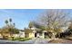 Charming single-story home with a well-manicured lawn, two-car garage, and neutral color palette at 6325 N 83Rd Pl, Scottsdale, AZ 85250