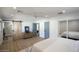 Spacious main bedroom features a barn door to the bathroom, walk in closet, and light wood floors at 6325 N 83Rd Pl, Scottsdale, AZ 85250