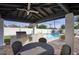 Outdoor kitchen with built-in grill and countertop space, perfect for alfresco dining and poolside entertaining at 6325 N 83Rd Pl, Scottsdale, AZ 85250