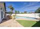 Backyard oasis with a refreshing pool, lush landscaping, and a covered patio at 6325 N 83Rd Pl, Scottsdale, AZ 85250