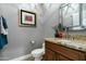 Charming powder room with granite countertop and decorative mirror at 6711 E Camelback Rd # 43, Scottsdale, AZ 85251