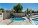 Inviting hot tub with tiled trim next to a community pool at 6711 E Camelback Rd # 43, Scottsdale, AZ 85251