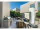 An attractive outdoor space with a built-in grill and covered seating area at 6711 E Camelback Rd # 43, Scottsdale, AZ 85251