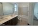 Bathroom features double sink vanity, bathtub and shower combination, and tile flooring at 7050 E Brushy Bill Rd, San Tan Valley, AZ 85143