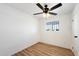 Comfortable bedroom with neutral decor, laminate flooring, ceiling fan and natural light at 737 W Jones Ave, Phoenix, AZ 85041