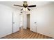 Bright bedroom featuring neutral tones, laminate flooring, and ample closet space for organized living at 737 W Jones Ave, Phoenix, AZ 85041