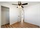 Bedroom with closet space, neutral walls, and wood-look flooring, offering a versatile living space at 737 W Jones Ave, Phoenix, AZ 85041