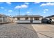 Charming single-story home featuring a gravel front yard and a driveway leading to the entrance at 737 W Jones Ave, Phoenix, AZ 85041