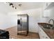 Kitchen featuring stainless steel appliances, granite countertops, and wood-look floors at 737 W Jones Ave, Phoenix, AZ 85041