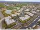 Aerial view of community featuring pools, walking paths, golf course and water views at 7601 E Indian Bend Rd # 1017, Scottsdale, AZ 85250