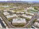 Aerial of condo buildings surrounding community pool, near Four Peaks and Silverado Golf Course at 7601 E Indian Bend Rd # 1017, Scottsdale, AZ 85250