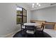 Cozy dining area showcasing a round table, four chairs, and a window overlooking the outdoors at 7601 E Indian Bend Rd # 1017, Scottsdale, AZ 85250