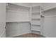 Spacious walk-in closet featuring ample shelving and rods for organized storage at 7601 E Indian Bend Rd # 1017, Scottsdale, AZ 85250