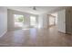 Bright bedroom features neutral tile flooring, ceiling fan, and bright windows at 7800 E Lincoln E Dr # 1102, Scottsdale, AZ 85250