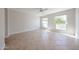 Bright bedroom featuring tiled floors, ample natural light from two large windows and a ceiling fan at 7800 E Lincoln E Dr # 1102, Scottsdale, AZ 85250