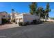 Well-maintained condo features a private garage, desert landscaping, and mature trees at 7800 E Lincoln E Dr # 1102, Scottsdale, AZ 85250