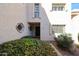 Inviting front entryway featuring manicured shrubs and elegant exterior wall details at 7800 E Lincoln E Dr # 1102, Scottsdale, AZ 85250