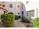 Welcoming condo exterior with manicured landscaping and a cozy pathway to the front door entrance at 7800 E Lincoln E Dr # 1102, Scottsdale, AZ 85250