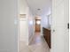 Hallway view of updated vanity, granite counters, and shower in bathroom at 7800 E Lincoln E Dr # 1102, Scottsdale, AZ 85250