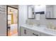 Bathroom with double sink vanity, black hardware, and views of the bedroom at 837 E Divot Dr, Tempe, AZ 85283