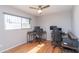 Versatile bedroom with wood floors; suitable as a home office with two workstations and bright natural light at 837 E Divot Dr, Tempe, AZ 85283