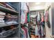 Organized closet with shelves and hanging rods to store clothing and accessories at 837 E Divot Dr, Tempe, AZ 85283