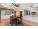 Bright dining area features stylish table, chairs, and custom built-in shelves and drawers at 837 E Divot Dr, Tempe, AZ 85283