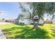 Charming single-story home with a well-manicured lawn and mature shade tree at 837 E Divot Dr, Tempe, AZ 85283